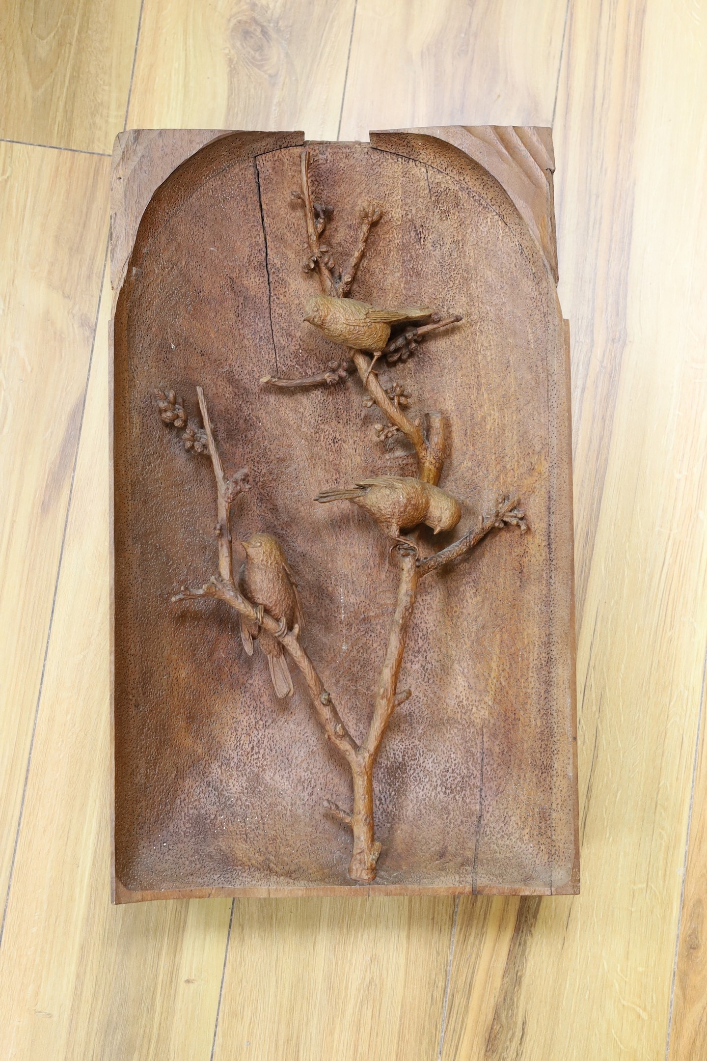 A large alpine wood carving - three birds, one detached section, 31 cms x 52 cms